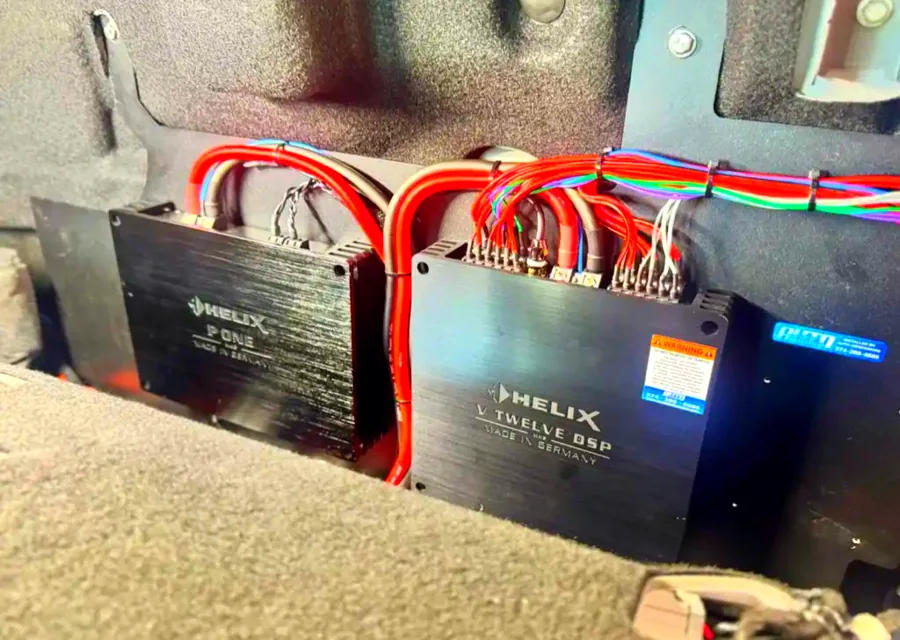 Amplifier rack wired into the floor of a vehicle