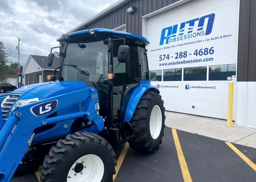 Tractor parked at the Auto Obsessions shop for commercial work