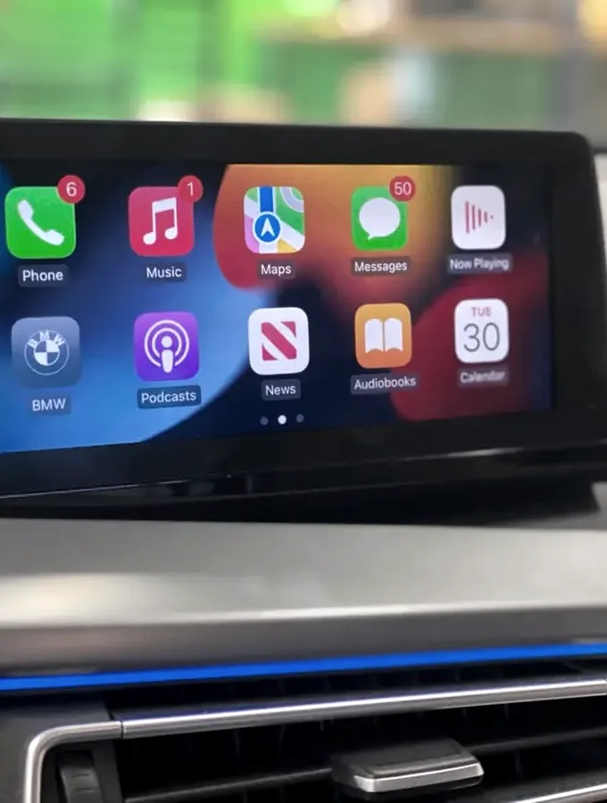 Apple CarPlay running on a factory dash screen after a retrofit by Auto Obsessions
